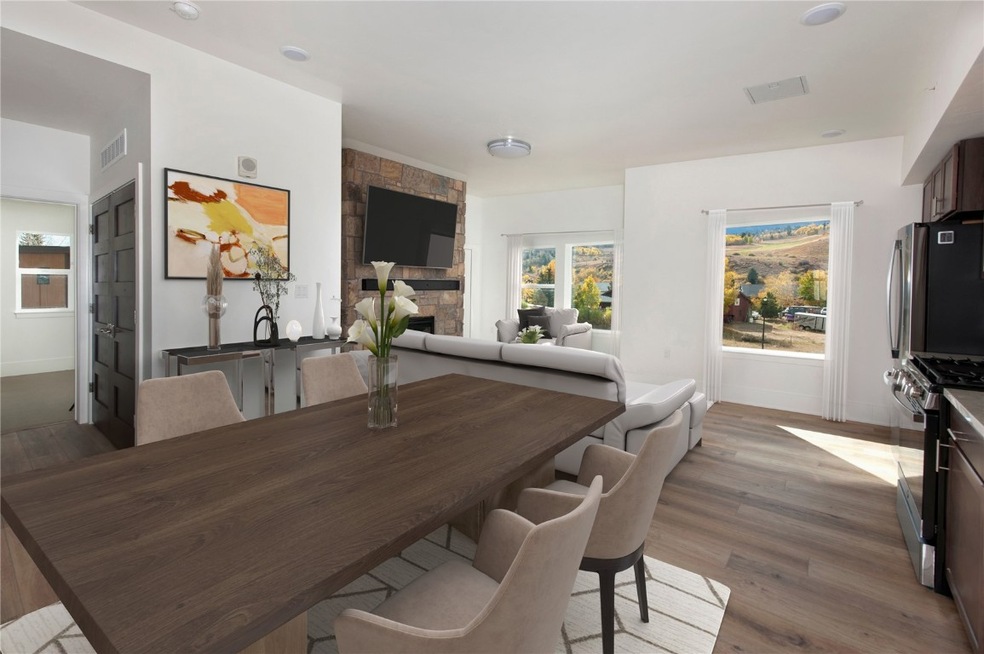Digitally-staged dining/living area