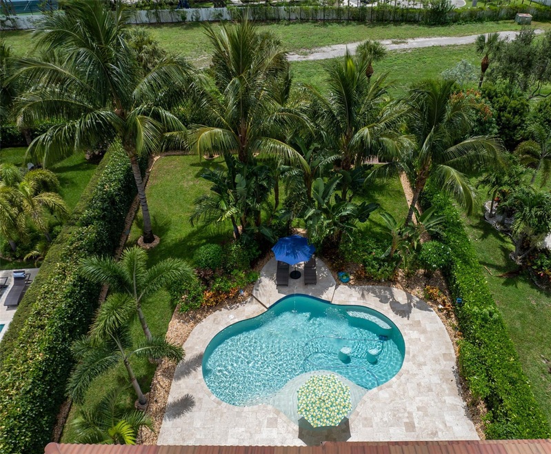 Custom pool with travertine deck, private fenced y