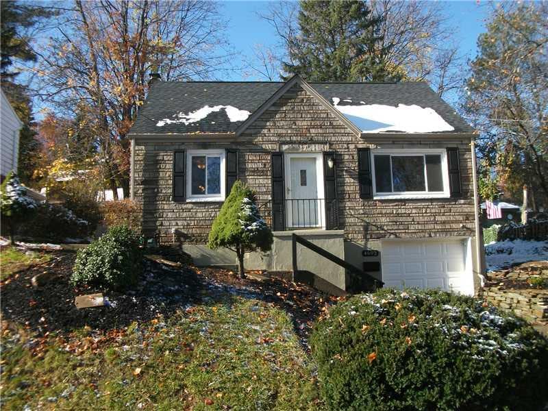 Exterior Front. New Roof, gutters, downspouts, shu