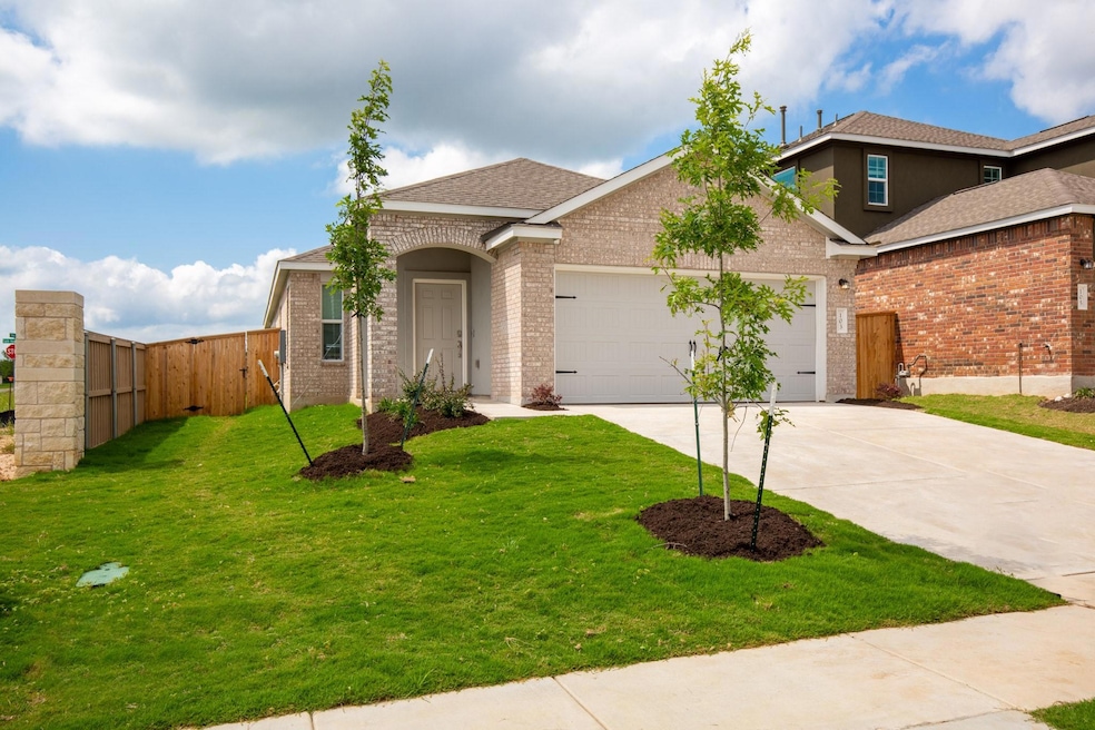 View of front facade with an attached garage, con