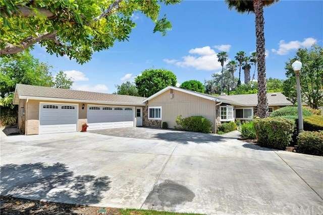 Single-story pool home on expansive lot with 3 car