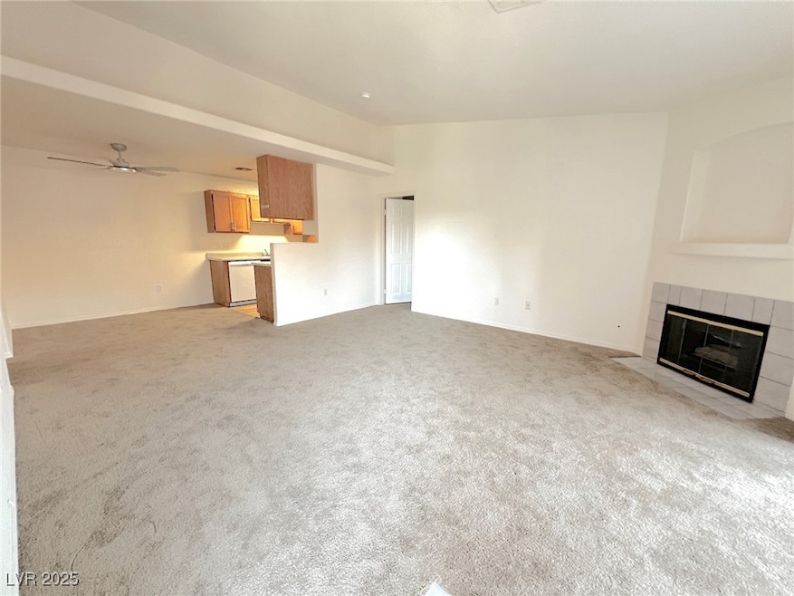 Unfurnished living room featuring a tile fireplace