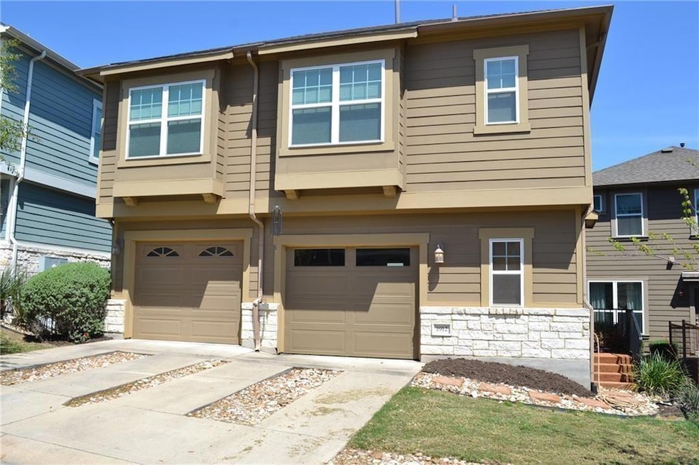 Multi unit property featuring a garage, concrete 