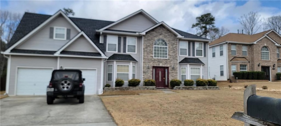 View of front of property with a garage