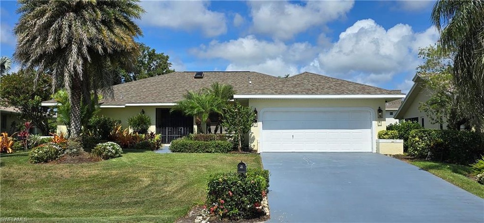 Ranch-style house with stucco siding, a front yard, driveway, a garage, and roof with shingles
