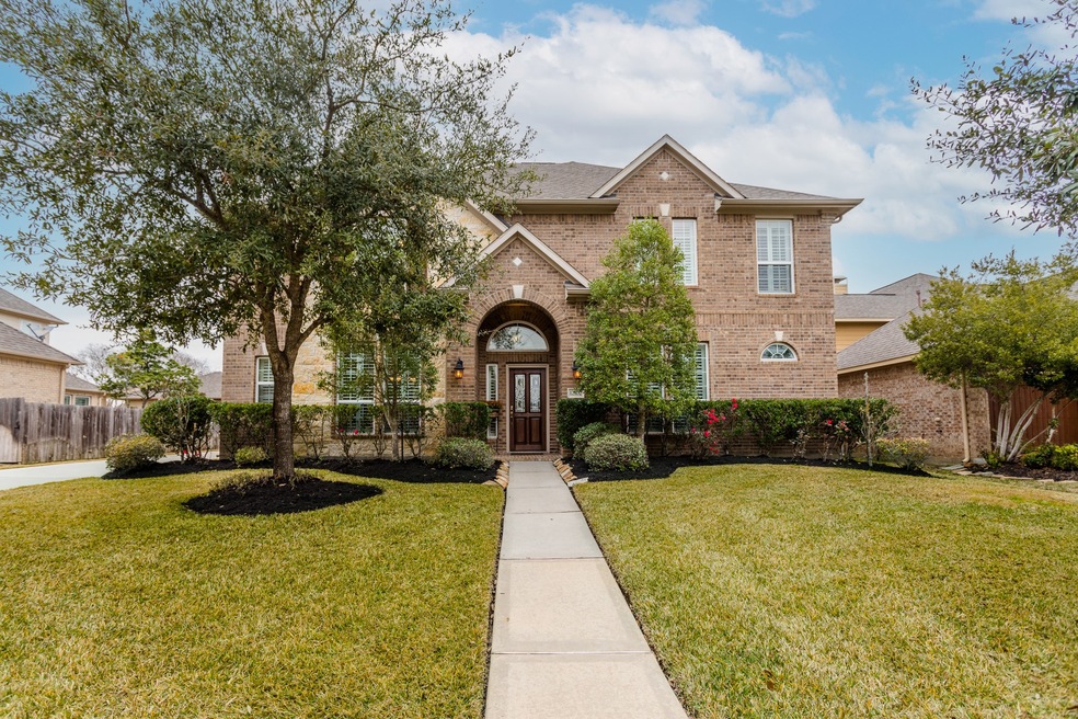 Welcome to 12102 Rampy Green Drive, in the beautiful, gated development of Treeline!