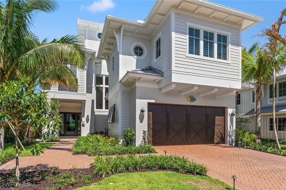 View of front of property with a garage, decorativ