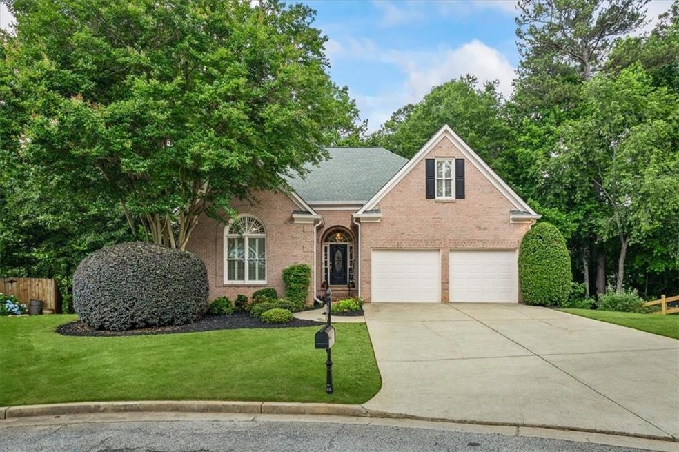 Timeless, traditional 3-sided brick home with amazing curb appeal