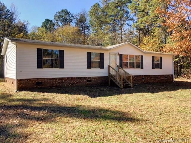 Front faces large yard.