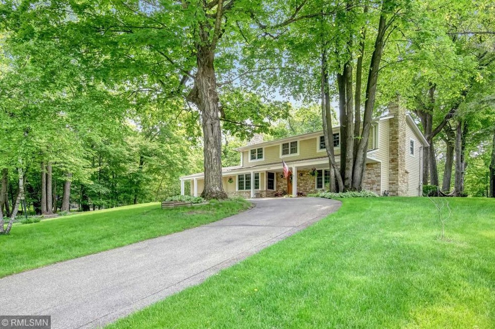 Situated on a gentle hillside, this timeless home 