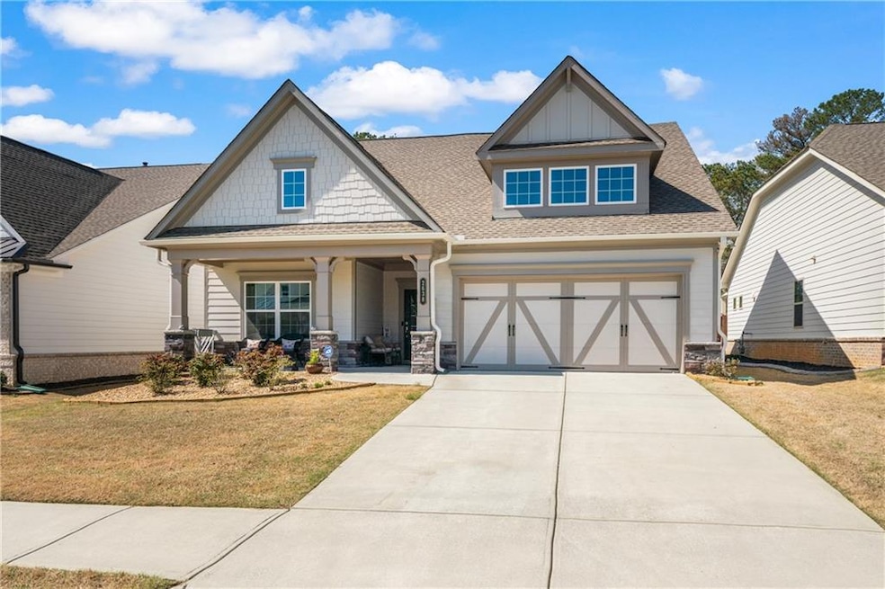 Craftsman-style home featuring a shingled roof, a 