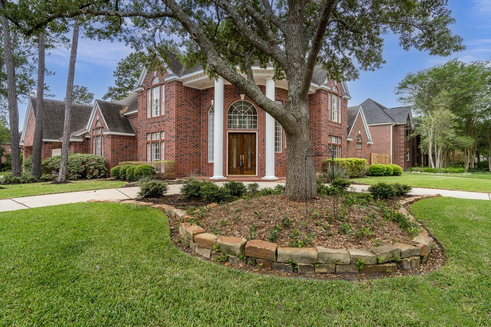 WELCOME to Lakewood Oaks Estates! Gorgeous mature trees, a circular front driveway on a large corner lot, a brick front porch, and eight foot double mahogany front doors invite you into your new home!