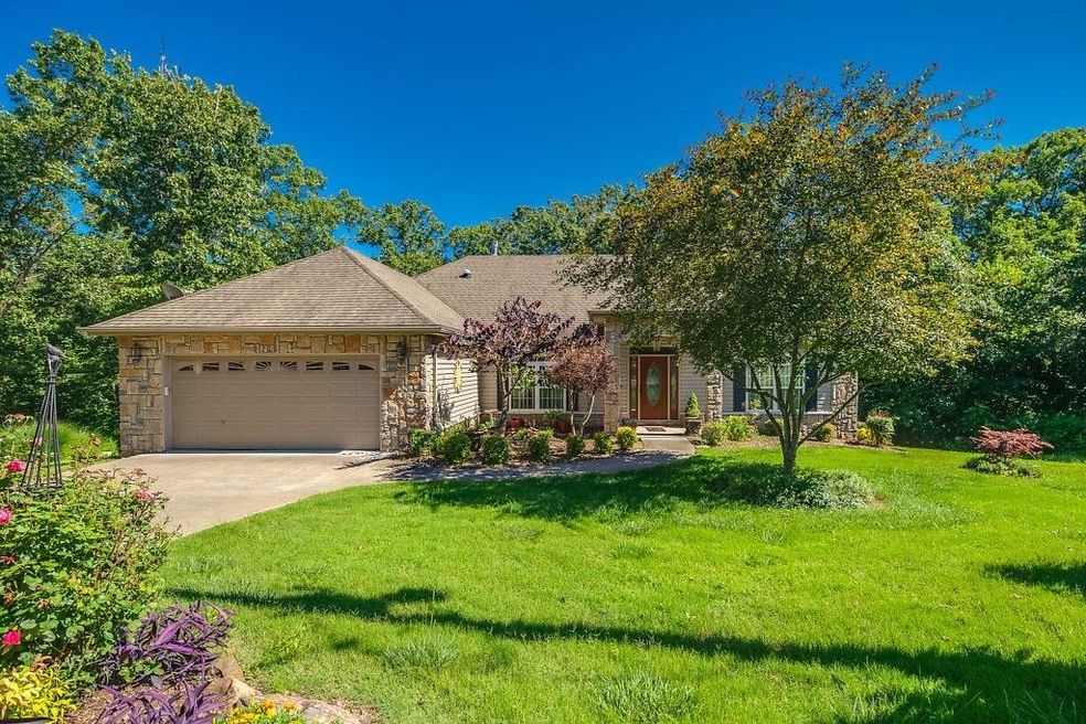 Mature surrounding trees provide a lovely natural setting