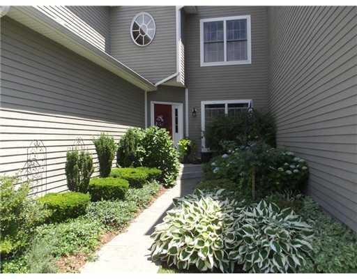 Exterior Front. Summer view of entrance with priva
