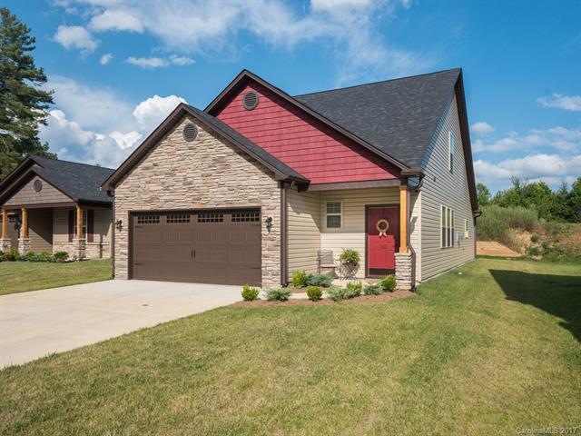 Carriage style garage doors adorns the front of th