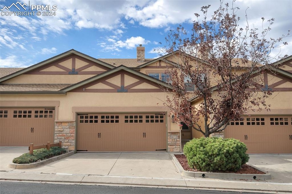 View of front of property featuring a garage
