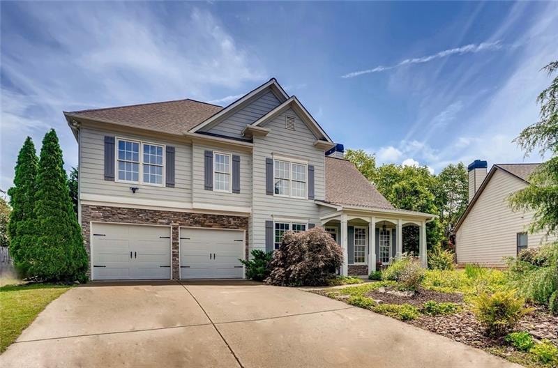 Private cul-de-sac home with stacked stone, cement