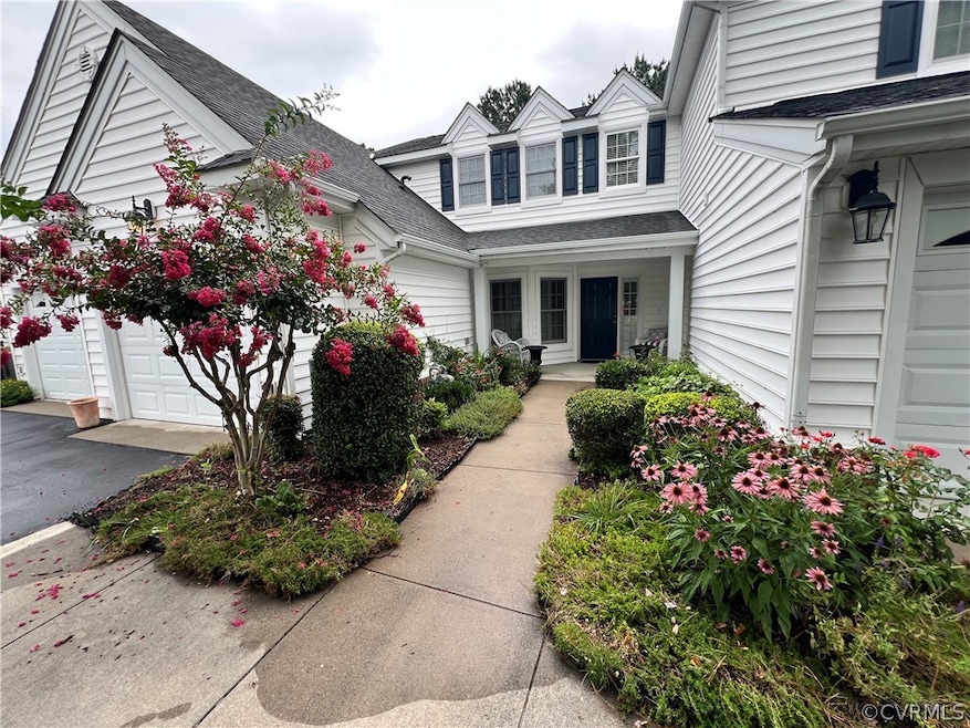 View of exterior entry featuring a garage