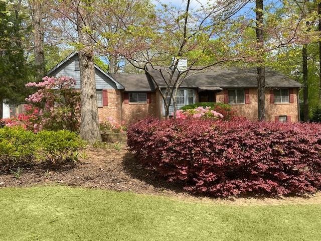 Spacious 4-sided brick house on corner lot.
