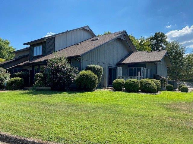 Sitting with a view of the golf course. 
