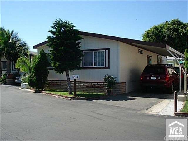 Exterior Front with two Car Covered Carport