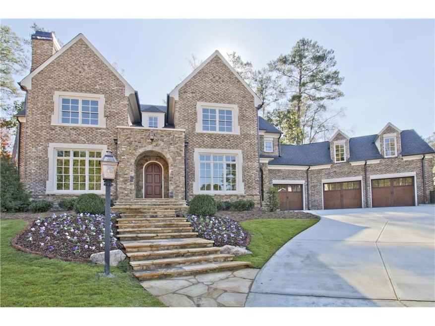 Brick and stone exterior with 3 car garage.