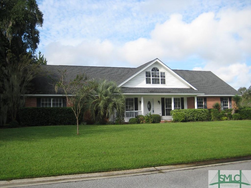 Large corner lot yard with landscaping, front porc