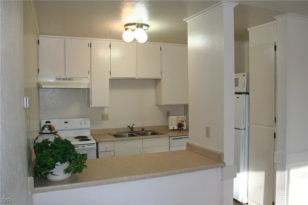 Kitchen open to great room with newer appliances.
