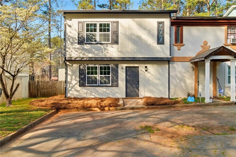 View of front of property featuring fence