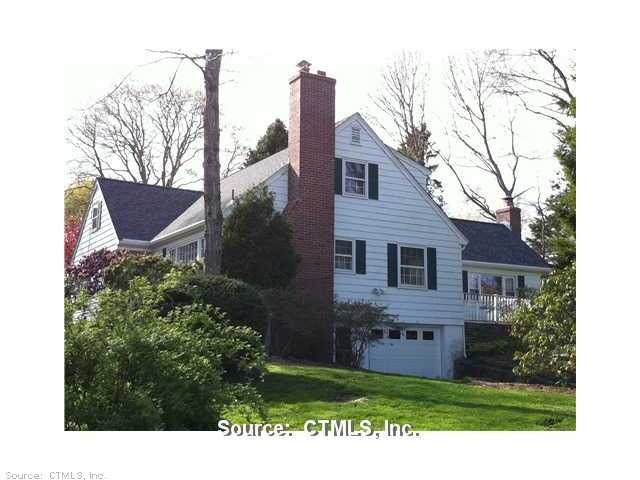Facade/Exterior Front. 2 car tandem garage under, 