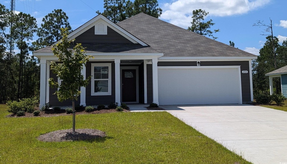 View of front of property with a garage, a porch, 