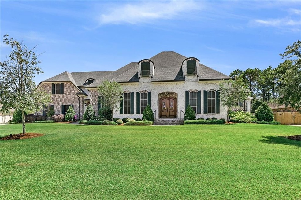 Beautiful home sits on 1/2 acre lot with lush land