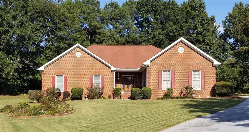 View of front of property featuring brick siding a