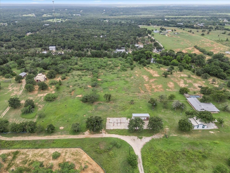 Aerial view of property and surrounding area with