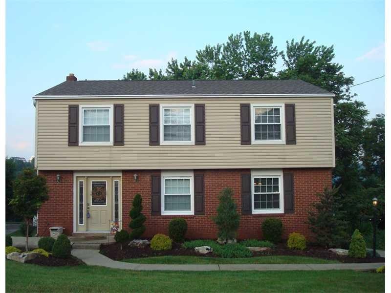 Exterior Front. Newer Roof and professional landsc