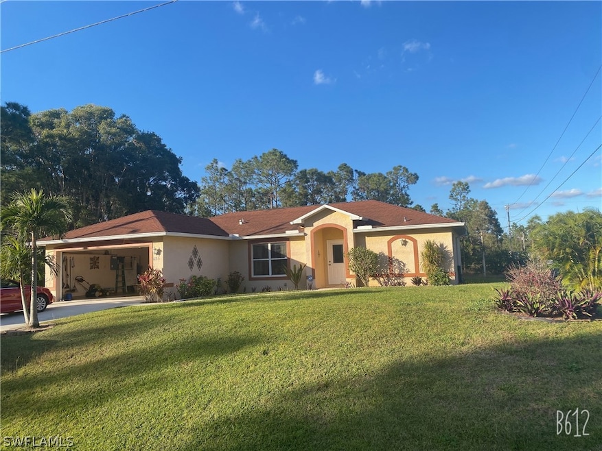 425 Broadmoor St, Lehigh Acres, FL 33974 - photo 1