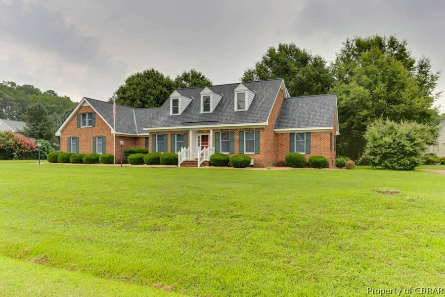 Beautiful cape cod brick home with numerous upgrad