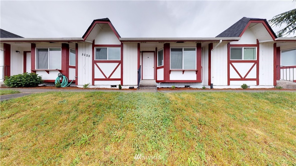 View from Tyler St, featuring refreshed landscaping and new windows.