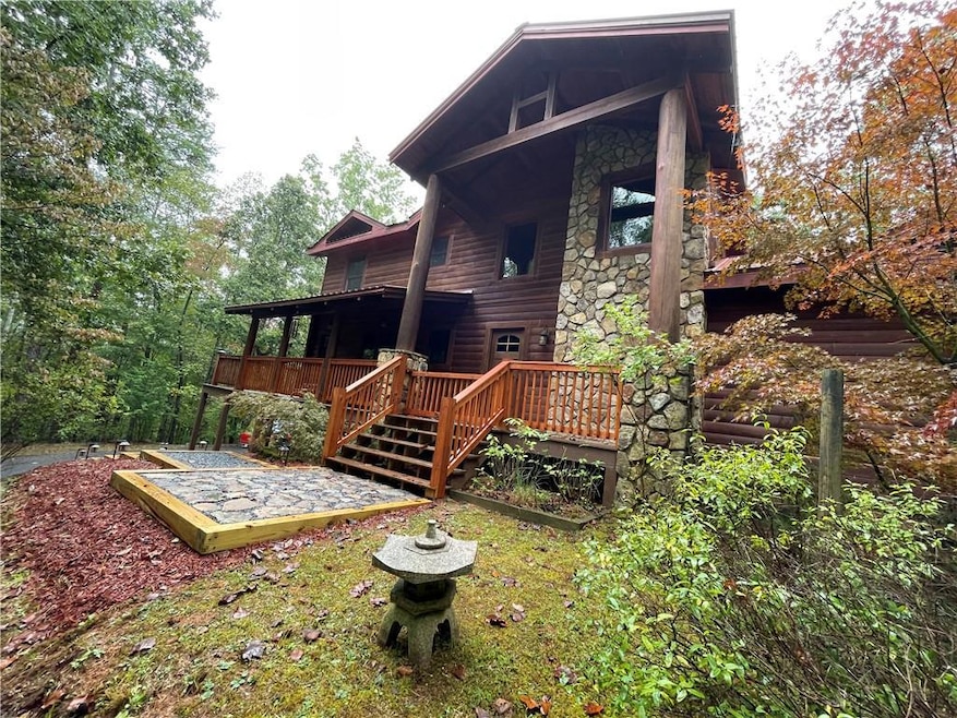 Back of property featuring a wooden deck