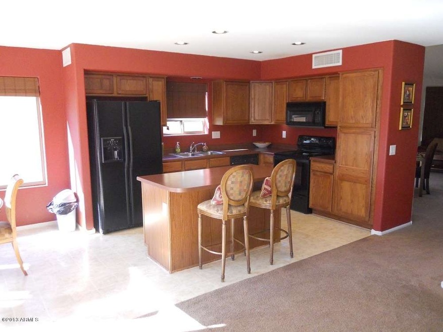 Kitchen with island.  Fridge included!
