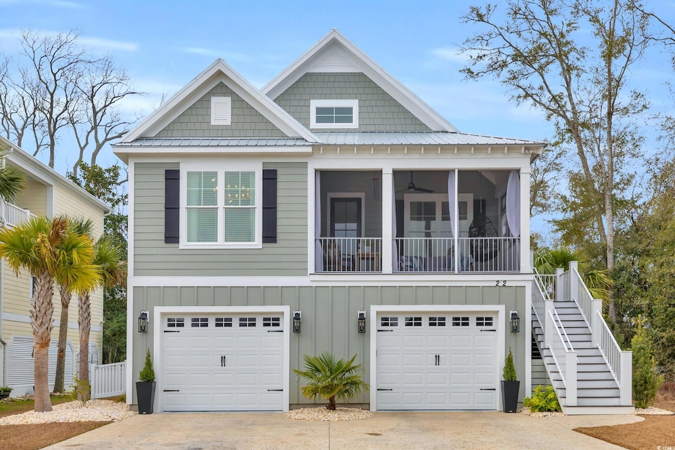 View of front of property featuring a sunroom and 