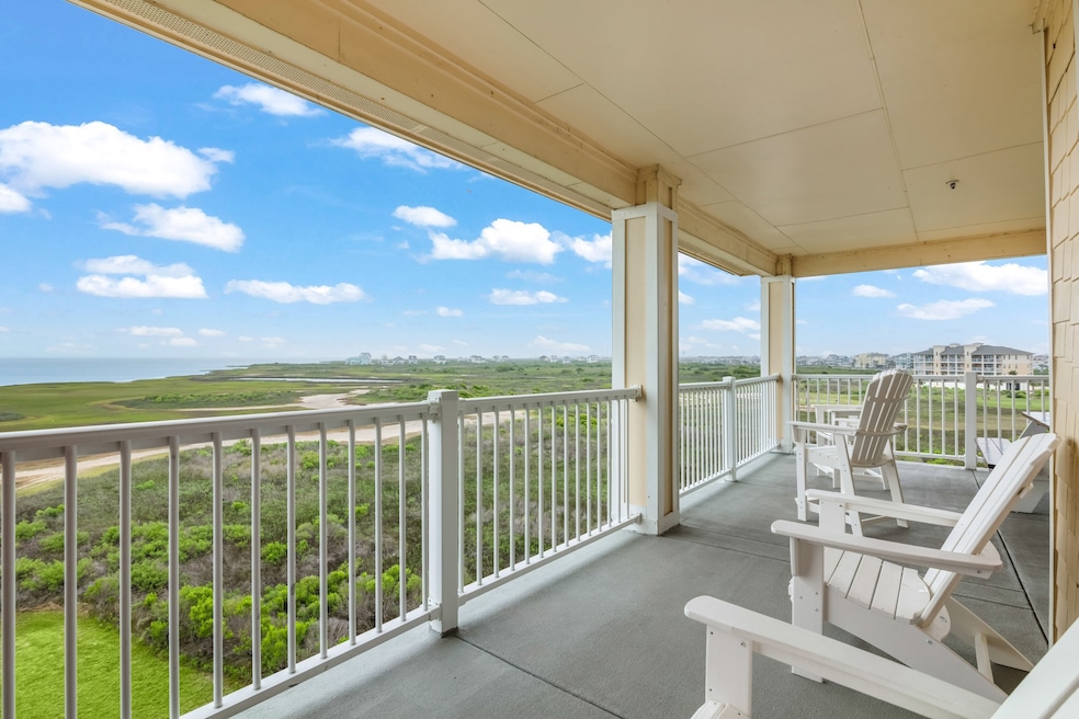 This photo showcases a spacious, covered balcony w