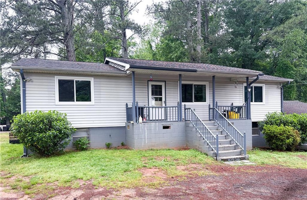 View of front facade featuring a porch, roof with 