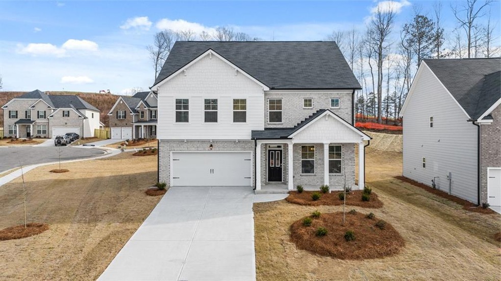 View of front of home featuring a garage