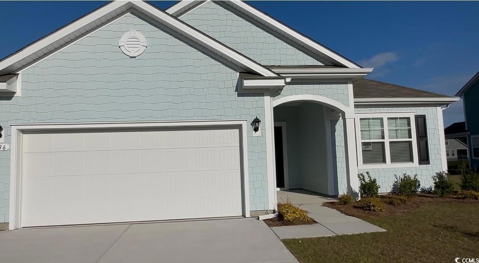 View of front facade featuring concrete driveway, 