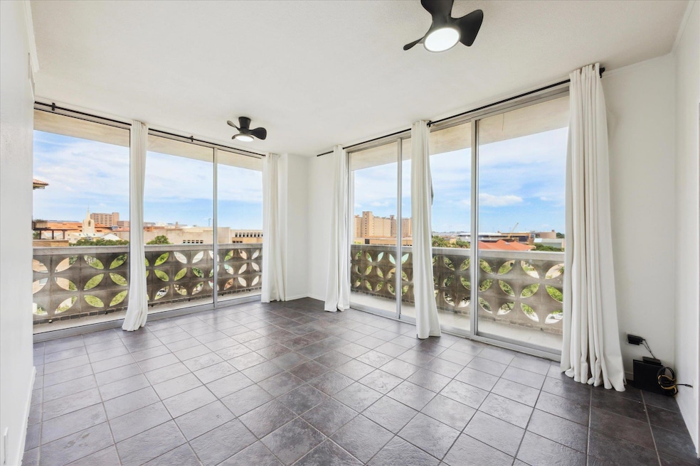 Primary Bedroom with wrap around balcony,  featuring healthy amount of natural light and a view of city