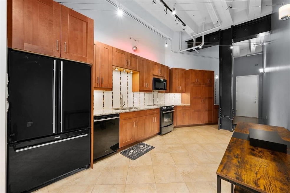 This modern kitchen features sleek black appliance