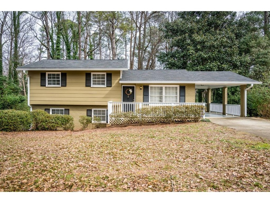 CHARMING FOUR BEDROOM HOME WITH CARPORT