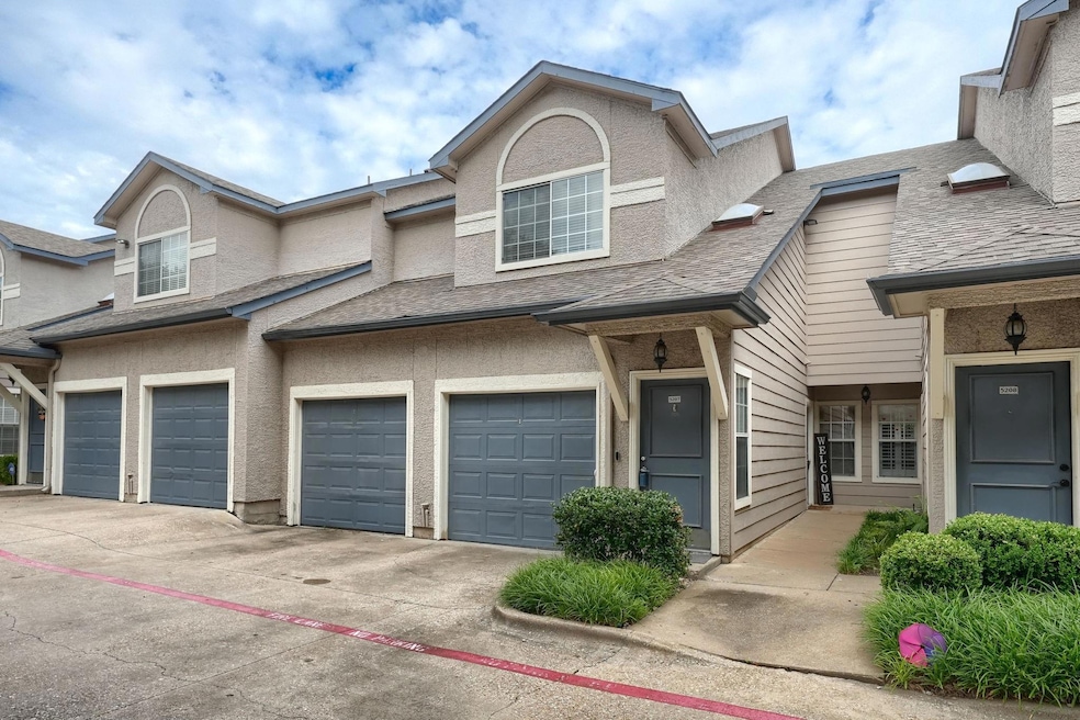 View of property featuring a garage