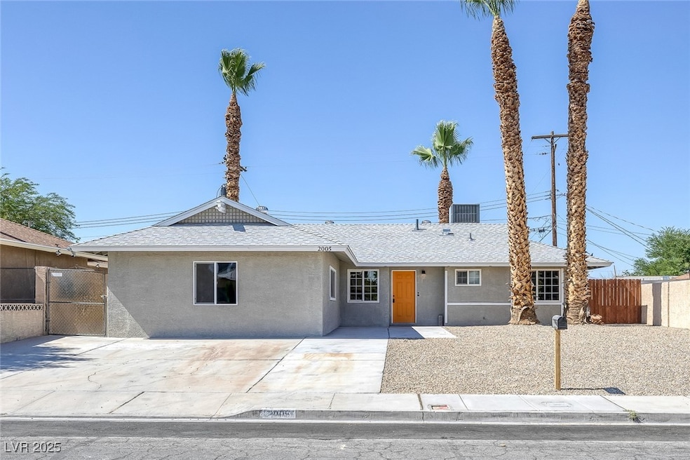 Ranch-style house with stucco siding and a shingle